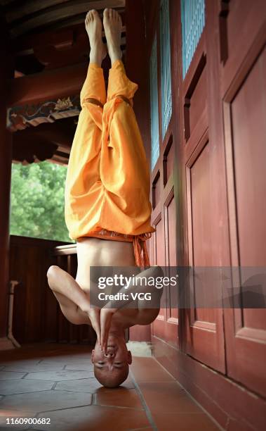 Monk practices martial art at the Quanzhou Shaolin Temple, also known as the South Shaolin Temple, on July 5, 2019 in Quanzhou, Fujian Province of...