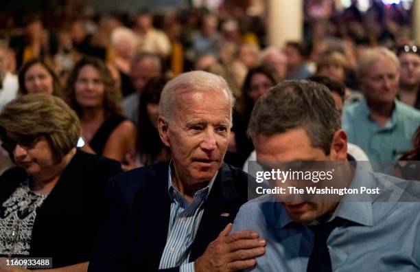 August 9: 2020 Democratic candidate for President former Vice President Joe Biden speaks to fellow candidate, Representative Tim Ryan, at the 2019...