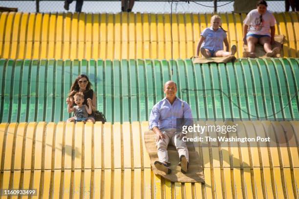 Des Moines, IA Congressman John Delaney takes a ride on the Giant Slide at the Iowa State Fair in Des Moines, Iowa on Aug. 10, 2018.