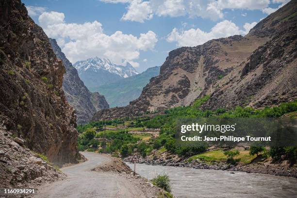winding road along panj river and afghanistan border, tajikistan, central asia - amu darya river stock pictures, royalty-free photos & images