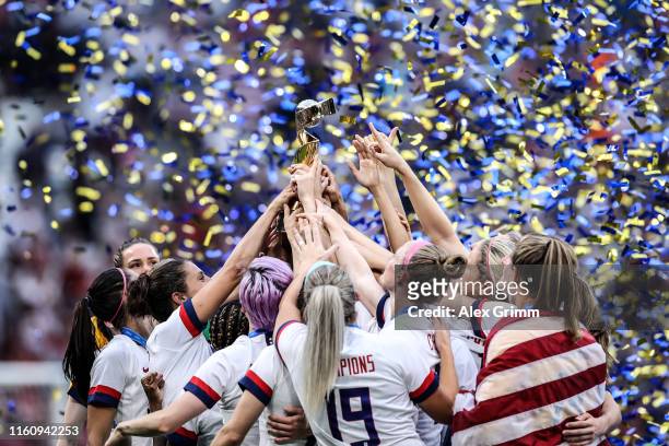 Players of the USA lift the FIFA Women's World Cup Trophy following their team's victory in the 2019 FIFA Women's World Cup France Final match...