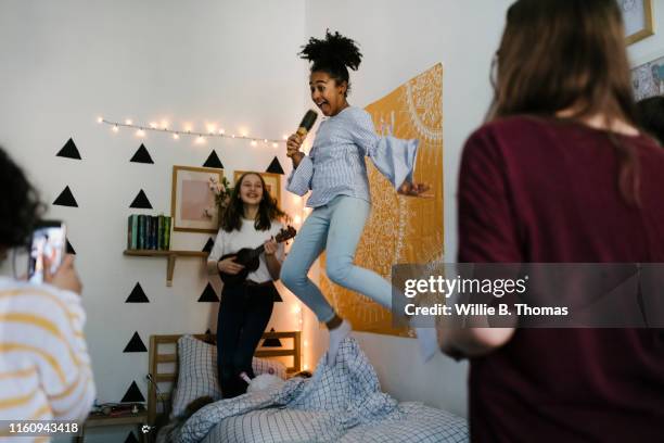 black tween jumping in the air - girl bedroom stock pictures, royalty-free photos & images