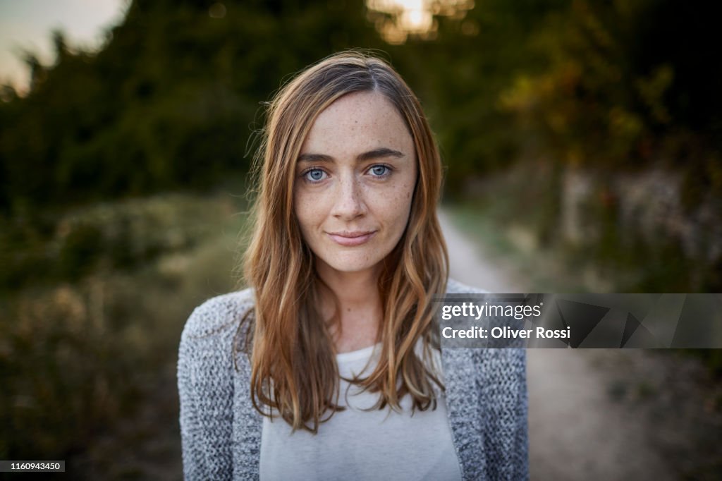 Portrait of smiling woman in the countryside