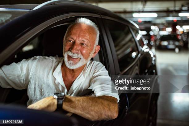 driving himself to work - audi car stock pictures, royalty-free photos & images
