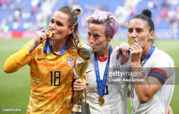 Ashlyn Harris, Megan Rapinoe and Ali Krieger of the USA celebrate with the FIFA Women's World Cup Trophy following the 2019 FIFA Women's World Cup...