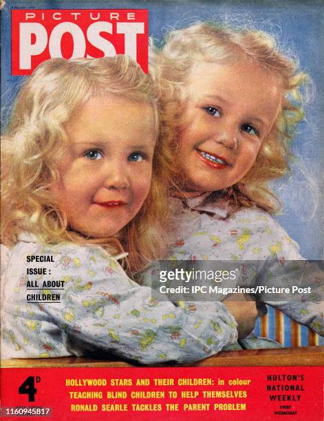Three-year-old twins Kay and Lynn Bruce are featured for the cover of Picture Post magazine. Original Publication: Picture Post Cover - Vol 65 No 10...