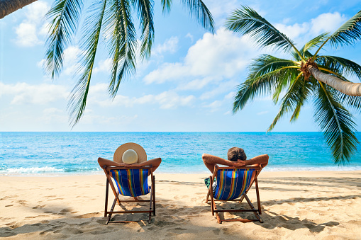 Couple relax on the beach enjoy beautiful sea on the tropical island 1160947136