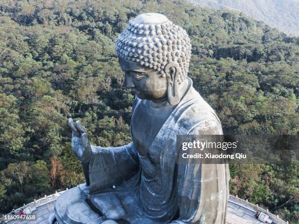 hong kong tian tan buddha at dusk - lantau stock pictures, royalty-free photos & images