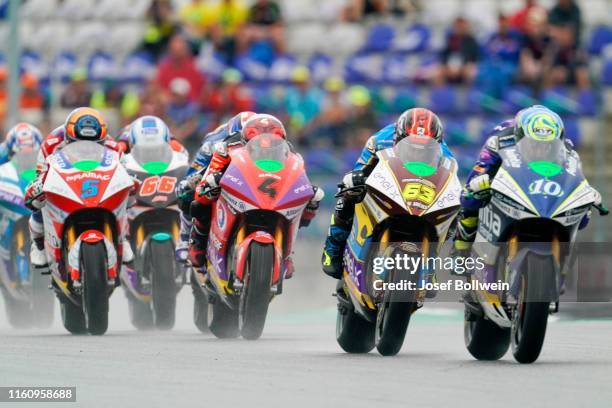 Alex De Angelis of San Marino and Octo Pramac MotorE. Hector Garzo of Spain and SPA Tech 3 E-Racing and Mike Di Meglio of Italy and EG 0, 0 Marco VDS...