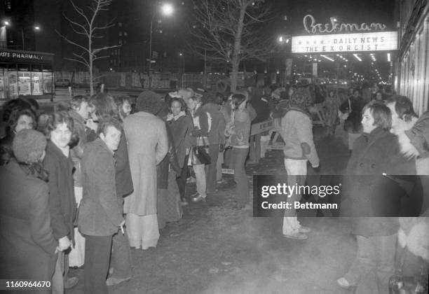 Scene from Dante's "Inferno?" It might be, with steam rising from a sidewalk grate, and a crowd lined up in 17-degree temperature waiting to see "The...