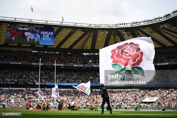 The rose flag is flown on the pitch ahead of the start of the international Test rugby union match between England and Wales at Twickenham Stadium in...