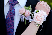 Hands of date Prom night flowers corsage formal wear