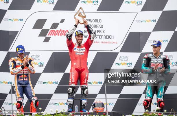 Repsol Honda Team's Spanish rider Marc Marquez, winner Mission Winnow Ducati's Italian rider Andrea Dovizioso and third placed Petronas Yamaha SRT's...