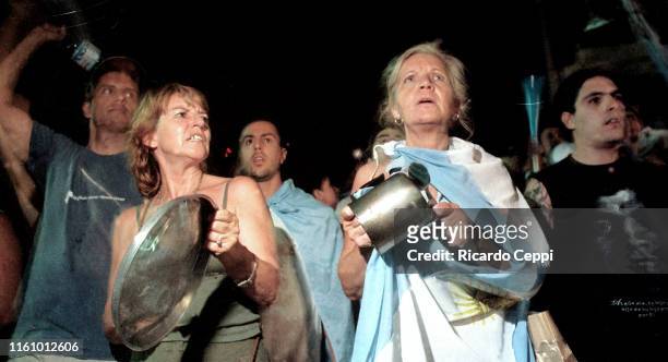 Demonstrators gather outside the National Congress on December 19, 2001 in Buenos Aires, Argentina. President Fernando De la Rua declared a state of...