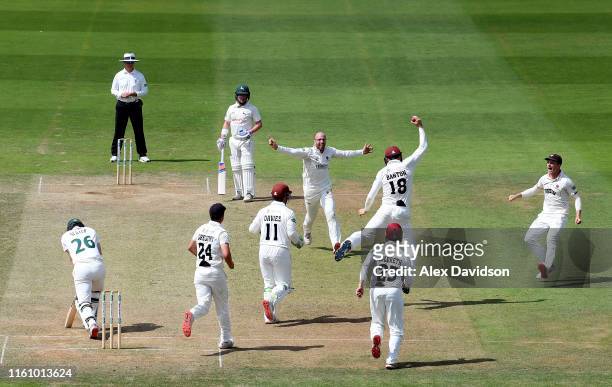 Tom Banton and Jack Leach of Somerset celebrate the wicket of Ben Slater of Nottinghamshire during Day Three of the Specsavers County Championship...