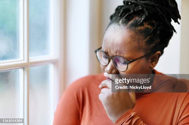 emotionally victimized - crying sad african woman stock pictures, royalty-free photos & images