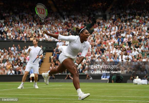 Serena Williams of the United States, playing partner of Andy Murray of Great Britain reacts in their Mixed Doubles second round match against...