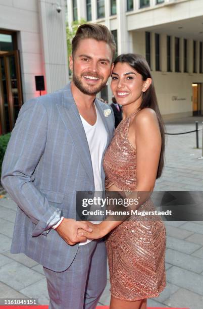 Johannes Haller and his girlfriend Yeliz Koc attends the Red Summer Night by Bunte.de at Rocco Forte The Charles Hotel on July 09, 2019 in Munich,...