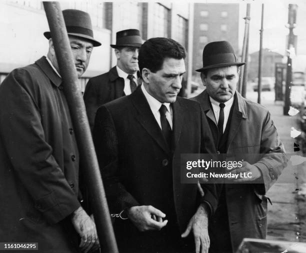 John "Sonny" Franzese is led back to a police car on December 29, 1966 after visiting the funeral parlor in Brooklyn, New York, where his mother,...