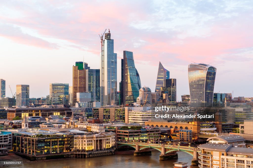 City of London skyline and Thames river at sunset, high angle view, London, UK