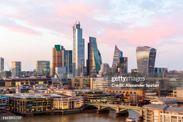 city of london skyline and thames river at sunset, high angle view, london, uk - city of london stockfoto's en -beelden