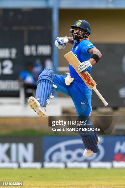 Virat Kohli of India celebrates his century during the 2nd ODI match between West Indies and India at Queens Park Oval in Port of Spain, Trinidad and...