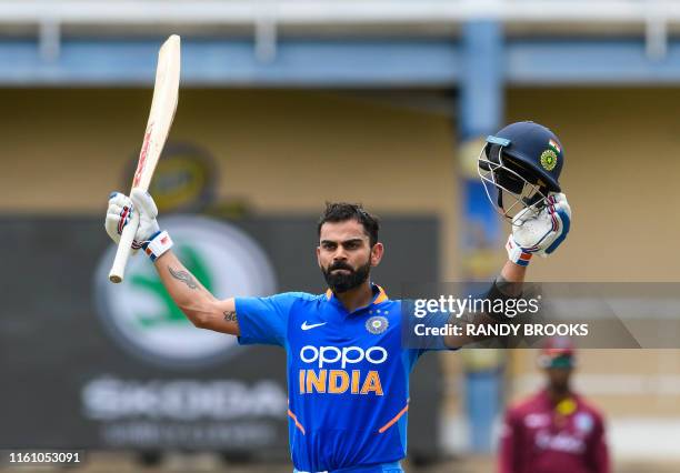 Virat Kohli of India celebrates his century during the 2nd ODI match between West Indies and India at Queens Park Oval in Port of Spain, Trinidad and...