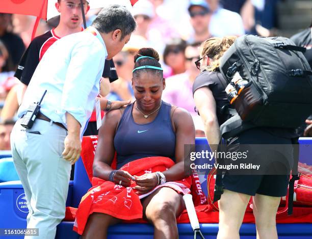 Serena Williams of the United States becomes upset after withdrawing from the final match against Bianca Andreescu of Canada due to a back injury on...