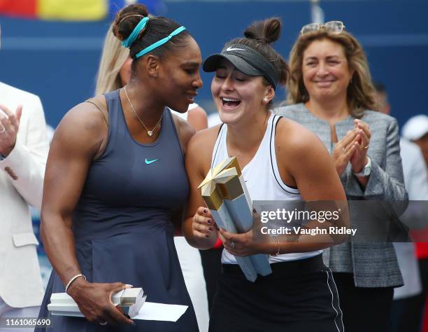 Serena Williams of the United States speaks with Bianca Andreescu of Canada following her withdrawal from the final match due to a back injury on Day...