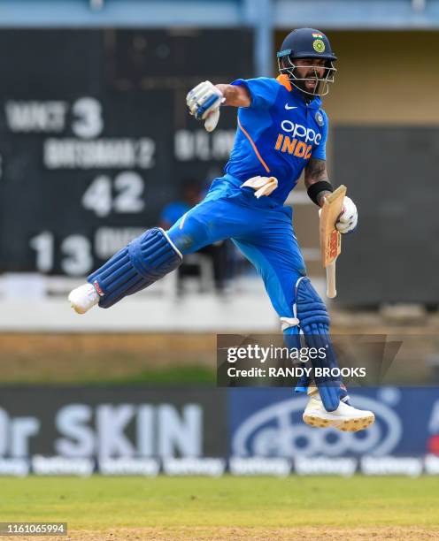 Virat Kohli of India celebrates his century during the 2nd ODI match between West Indies and India at Queens Park Oval in Port of Spain, Trinidad and...