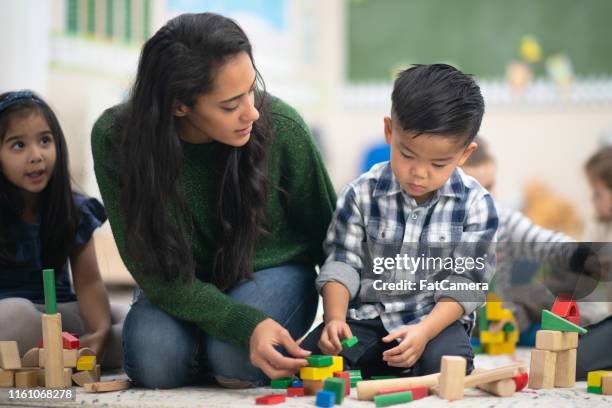 happy boy playing with blocks - montessori education stock pictures, royalty-free photos & images