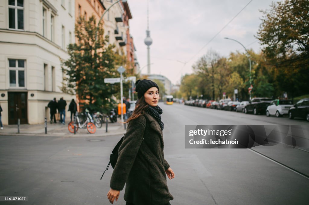 Young woman walking in Berlin Mitte