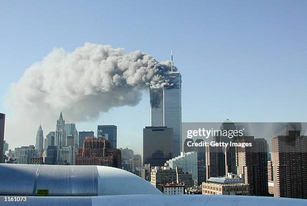 Smoke pours from the World Trade Center after being hit by two planes September 11, 2001 in New York City.