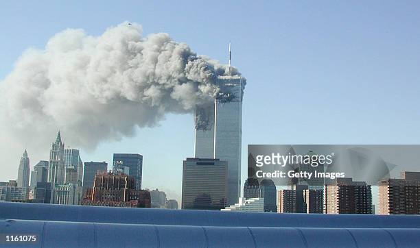 Smoke pours from the World Trade Center after being hit by two planes September 11, 2001 in New York City.