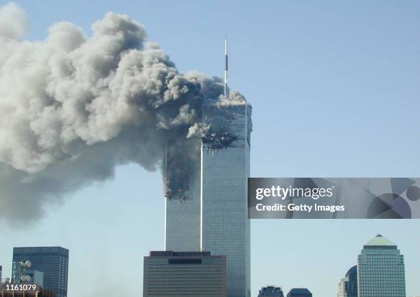 Smoke pours from the World Trade Center after being hit by two planes September 11, 2001 in New York City.