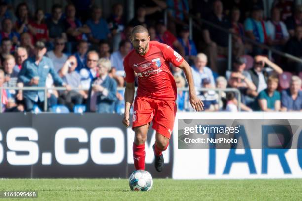 Ashton Götz of Drochtersen runs with the ball during the DFB Cup first round match between SV Drochtersen/Assel and FC Schalke 04 at the Kehdinger...