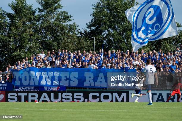 Supporters of Schalke 04 shows an anti-racism banner against Clemens Tönnies, supervisory Board Chairman of Schalke prior the DFB Cup first round...