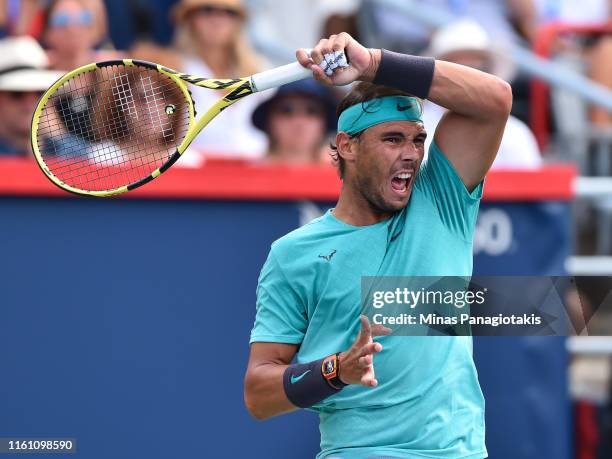 Rafael Nadal of Spain hits a return against Daniil Medvedev of Russia during the mens singles final on day 10 of the Rogers Cup at IGA Stadium on...