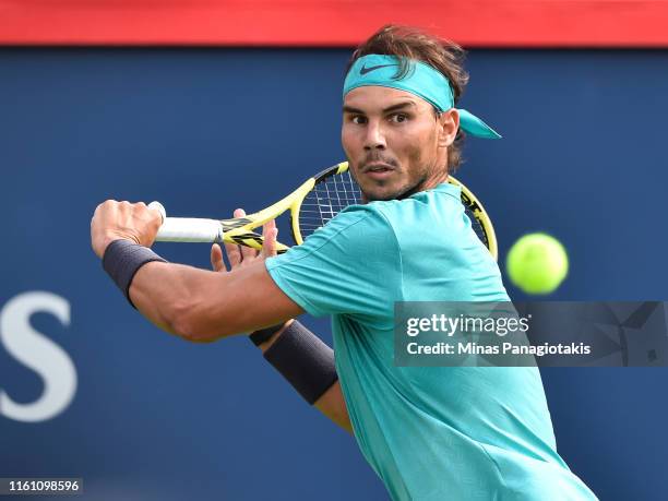 Rafael Nadal of Spain keeps his focus on the ball against Daniil Medvedev of Russia during the mens singles final on day 10 of the Rogers Cup at IGA...