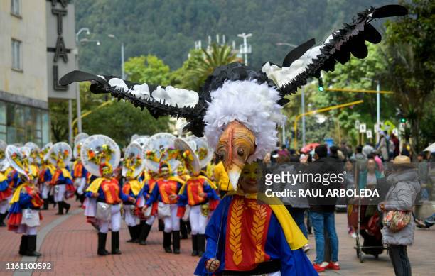 Actors perform during a parade honoring Colombia's Independence Bicentennial, part of Summer Festival celebrations in Bogota on August 11, 2019.