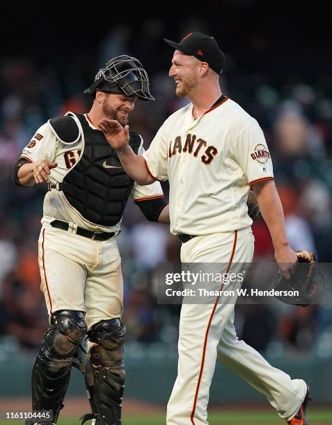 Will Smith and Stephen Vogt of the San Francisco Giants celebrates defeating the Philadelphia Phillies 9-6 at Oracle Park on August 11, 2019 in San...