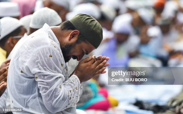 Muslim man joins others to offer Eid al-Adha prayers in Guwahati on August 12, 2019. - Muslims around the world are celebrating Eid al-Adha , the...