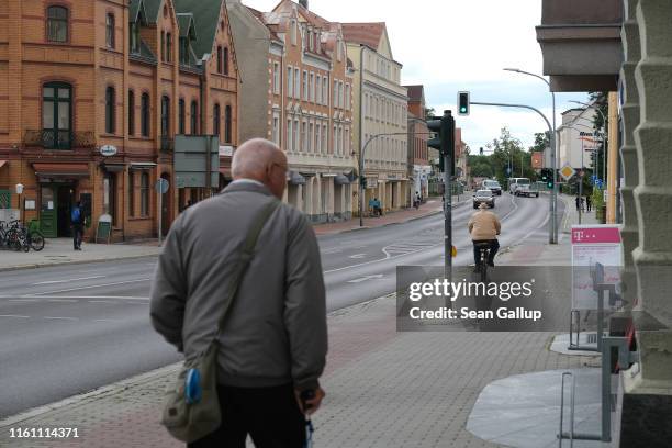 An elderly man walks on the main street in the town center on July 09, 2019 in Weisswasser, Germany. Weisswasser, located in Saxony near the border...