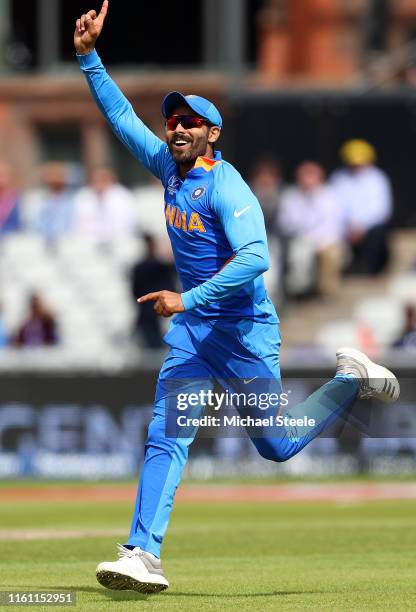 Ravindra Jadeja of India celebrates after running out Ross Taylor of New Zealand with a direct hit to the stumps during resumption of the Semi-Final...