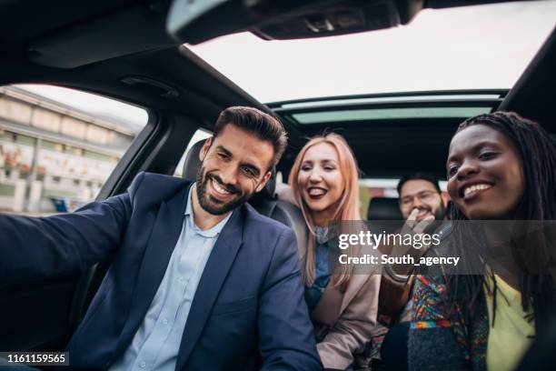 happy friends going on a road trip - car sharing stock pictures, royalty-free photos & images