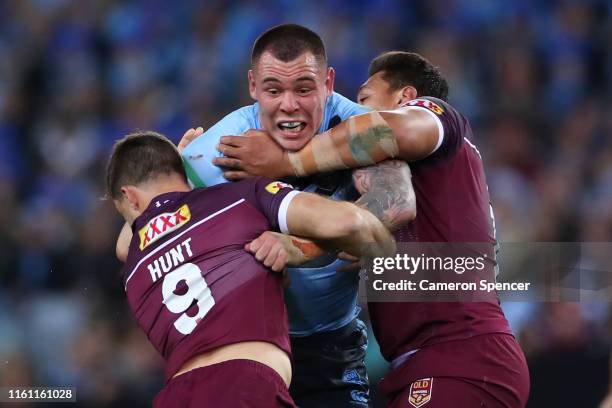 David Klemmer of the Blues is tackled during game three of the 2019 State of Origin series between the New South Wales Blues and the Queensland...