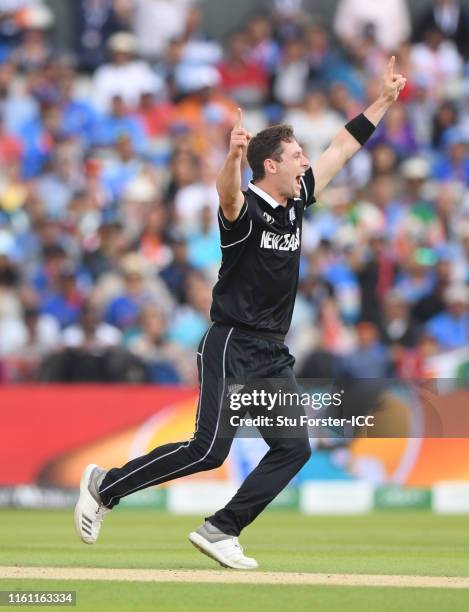 Matt Henry of New Zealand celebrates after taking the wicket of Dinesh Karthik of India during the Semi-Final match of the ICC Cricket World Cup 2019...