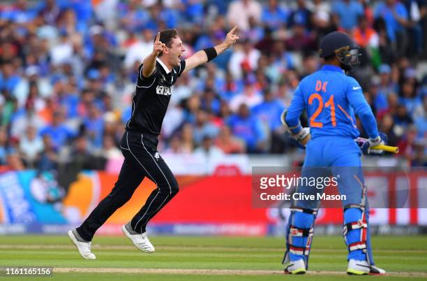 Matt Henry of New Zealand celebrates the wicket of Dinesh Karthik of India during resumption of the Semi-Final match of the ICC Cricket World Cup...