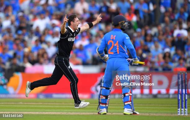 Matt Henry of New Zealand celebrates the wicket of Dinesh Karthik of India during resumption of the Semi-Final match of the ICC Cricket World Cup...