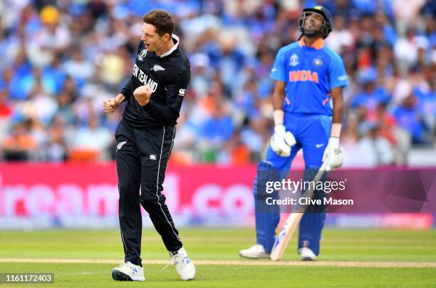 Mitchell Santner of New Zealand celebrates after dismissing Rishabh Pant of India during resumption of the Semi-Final match of the ICC Cricket World...